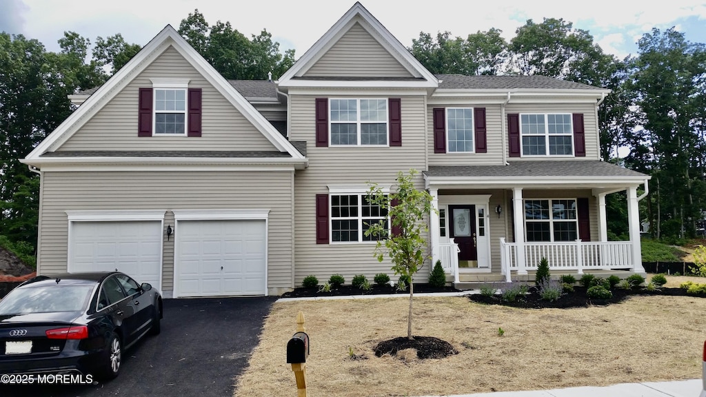 4 Christopher Dr, Howell, NJ 07731 - traditional-style house featuring covered porch, asphalt driveway, and a shingled roof