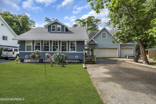 614 Bay Blvd, Bayville, NJ 08721 - view of front of property with a shingled roof, driveway, a front lawn, and a garage