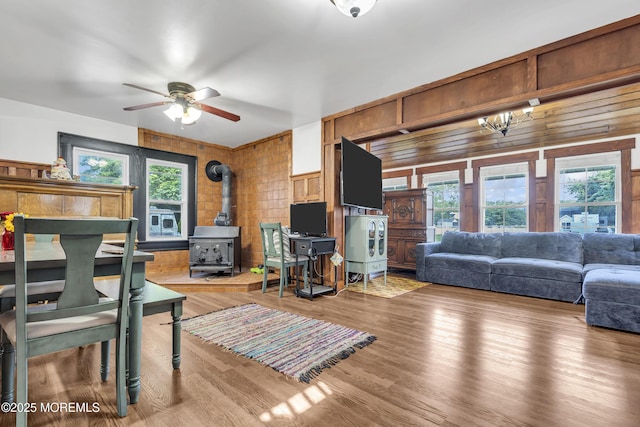 614 Bay Blvd, Bayville, NJ 08721 - living area with a wood stove, ceiling fan, healthy amount of natural light, and light wood finished floors