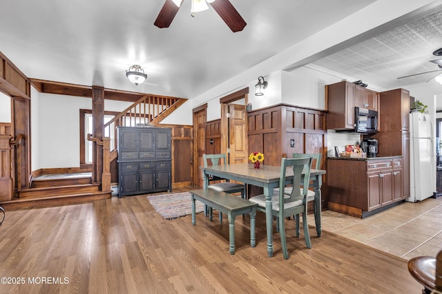 614 Bay Blvd, Bayville, NJ 08721 - dining area featuring ceiling fan, light wood-style flooring, and stairs