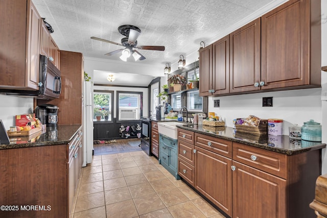 614 Bay Blvd, Bayville, NJ 08721 - kitchen featuring black microwave, ceiling fan, freestanding refrigerator, dark stone counters, and light tile patterned flooring