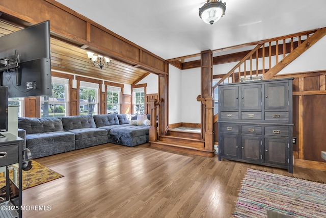 614 Bay Blvd, Bayville, NJ 08721 - living room featuring vaulted ceiling, wood finished floors, and a chandelier