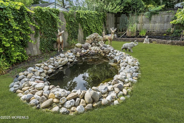 614 Bay Blvd, Bayville, NJ 08721 - fenced backyard featuring a small pond