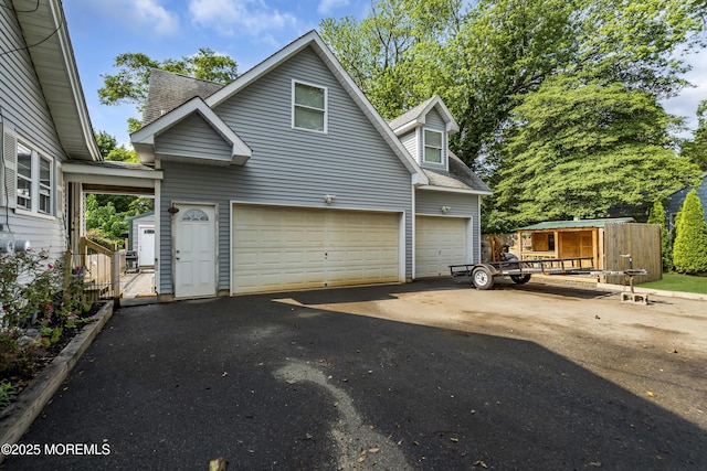 614 Bay Blvd, Bayville, NJ 08721 - view of front of property with asphalt driveway, roof with shingles, and a garage