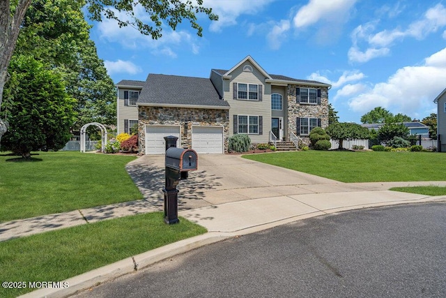 101 Taft Ct, Brick, NJ 08724 - view of front of house with stone siding, concrete driveway, a front lawn, and a garage