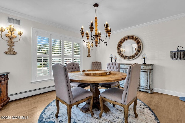 101 Taft Ct, Brick, NJ 08724 - dining space featuring baseboard heating, ornamental molding, a chandelier, and light wood finished floors