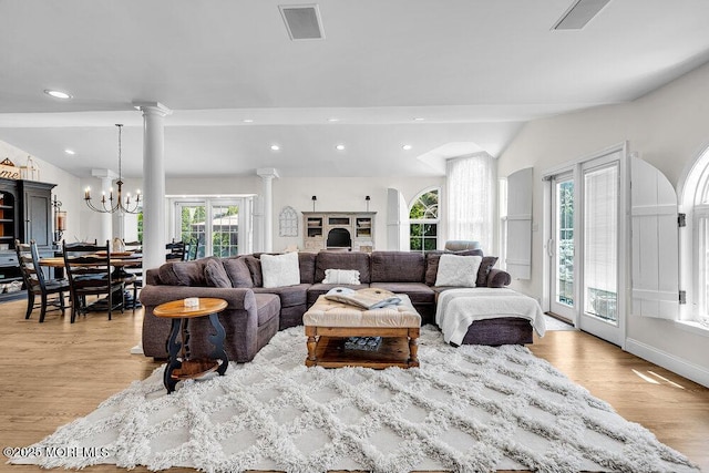 101 Taft Ct, Brick, NJ 08724 - living area with light wood finished floors, vaulted ceiling, a chandelier, and recessed lighting
