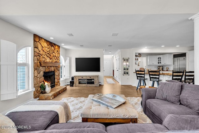 101 Taft Ct, Brick, NJ 08724 - living area with a fireplace, light wood-style floors, recessed lighting, and a baseboard heating unit