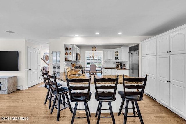 101 Taft Ct, Brick, NJ 08724 - dining room with recessed lighting, light wood finished floors, and a baseboard radiator