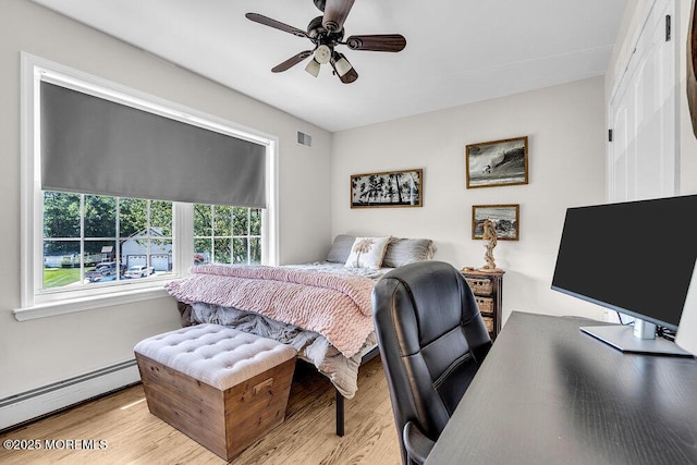 101 Taft Ct, Brick, NJ 08724 - bedroom featuring a baseboard radiator, wood finished floors, and a ceiling fan