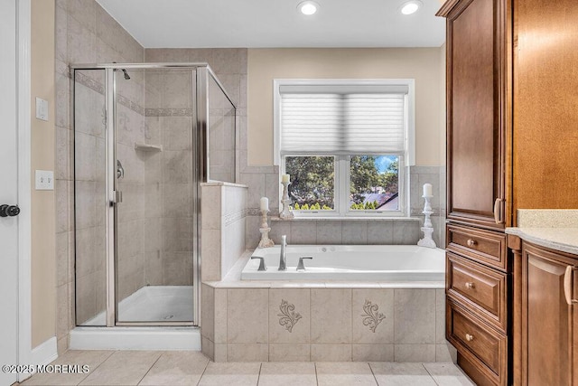 101 Taft Ct, Brick, NJ 08724 - bathroom with a bath, a shower stall, tile patterned flooring, recessed lighting, and vanity