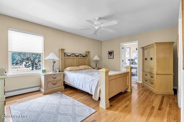 101 Taft Ct, Brick, NJ 08724 - bedroom with a baseboard heating unit, light wood-type flooring, and ceiling fan