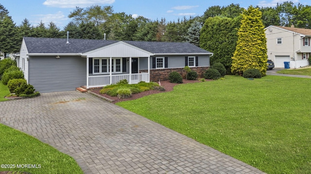34 Traymore Rd, Freehold, NJ 07728 - ranch-style home featuring a porch, a front lawn, roof with shingles, and decorative driveway