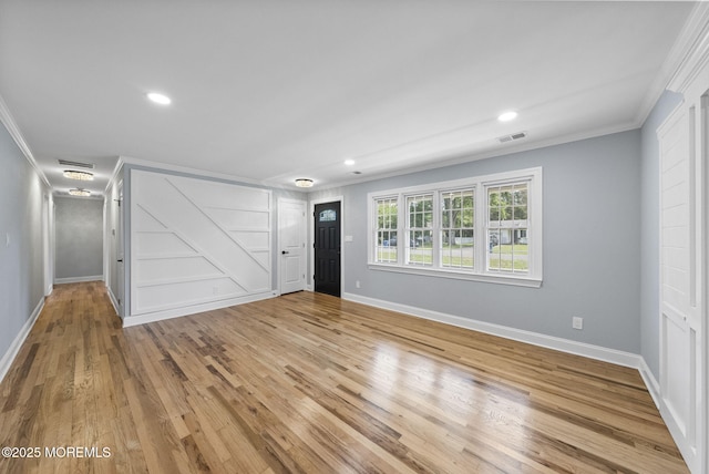 34 Traymore Rd, Freehold, NJ 07728 - unfurnished living room with ornamental molding, light wood-type flooring, and recessed lighting