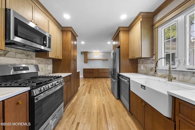 34 Traymore Rd, Freehold, NJ 07728 - kitchen featuring appliances with stainless steel finishes, light countertops, light wood-style flooring, and recessed lighting