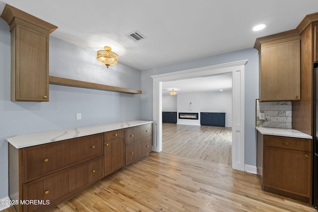 34 Traymore Rd, Freehold, NJ 07728 - kitchen featuring open shelves, light wood-type flooring, light countertops, backsplash, and recessed lighting
