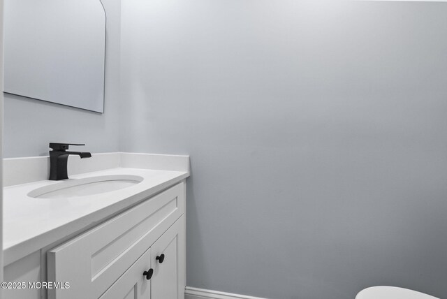 34 Traymore Rd, Freehold, NJ 07728 - half bathroom with vanity and toilet