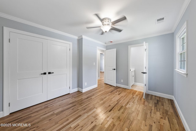 34 Traymore Rd, Freehold, NJ 07728 - unfurnished bedroom with light wood-style flooring, crown molding, a closet, a ceiling fan, and ensuite bath