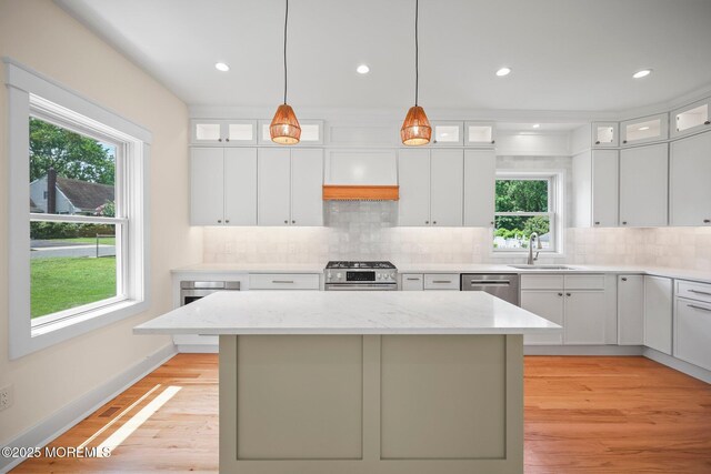 569 Ocean Blvd, Leonardo, NJ 07737 - kitchen with healthy amount of natural light, appliances with stainless steel finishes, a center island, tasteful backsplash, and recessed lighting