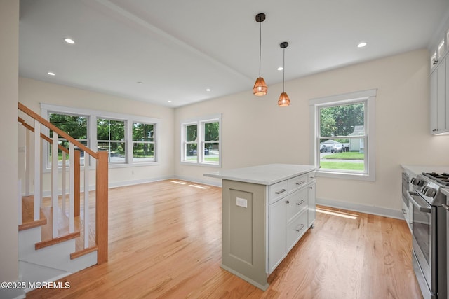569 Ocean Blvd, Leonardo, NJ 07737 - kitchen featuring stainless steel range, light wood finished floors, healthy amount of natural light, decorative light fixtures, and recessed lighting
