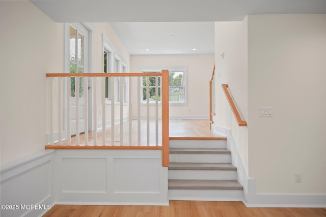 569 Ocean Blvd, Leonardo, NJ 07737 - stairs featuring wood finished floors, a wainscoted wall, a decorative wall, and recessed lighting