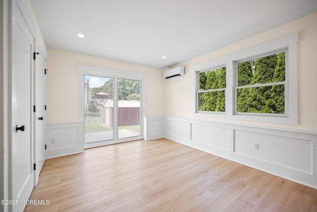 569 Ocean Blvd, Leonardo, NJ 07737 - spare room featuring a decorative wall, wainscoting, an AC wall unit, light wood-style floors, and recessed lighting