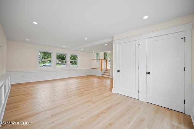 569 Ocean Blvd, Leonardo, NJ 07737 - unfurnished living room featuring light wood-style flooring, recessed lighting, and a wainscoted wall