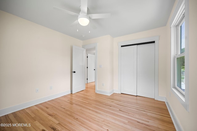 569 Ocean Blvd, Leonardo, NJ 07737 - unfurnished bedroom with light wood finished floors, a ceiling fan, and a closet