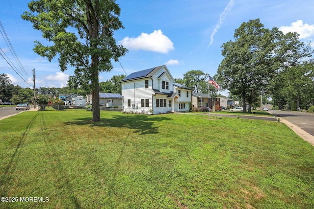 569 Ocean Blvd, Leonardo, NJ 07737 - view of front facade featuring a front yard and solar panels