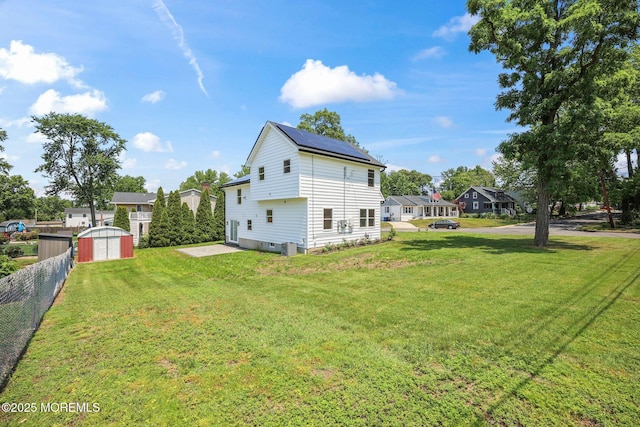 569 Ocean Blvd, Leonardo, NJ 07737 - view of side of home featuring a shed and roof mounted solar panels