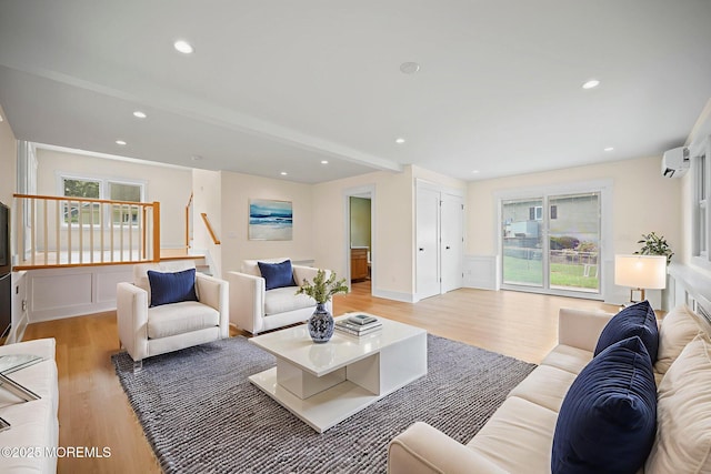 569 Ocean Blvd, Leonardo, NJ 07737 - living area featuring light wood finished floors, healthy amount of natural light, a wall mounted air conditioner, and recessed lighting