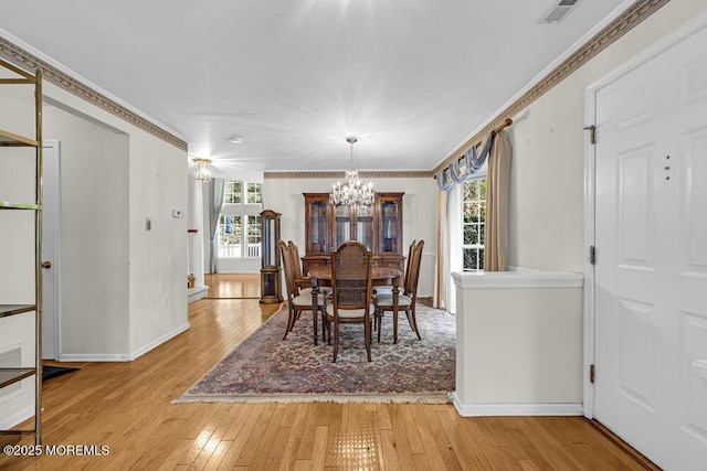 106 Tarpon Dr, Sea Girt, NJ 08750 - dining space with a chandelier, light wood finished floors, and ornamental molding