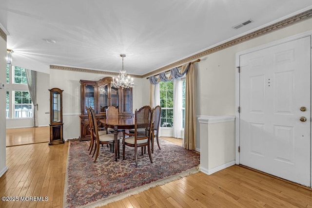 106 Tarpon Dr, Sea Girt, NJ 08750 - dining space featuring a chandelier, light wood-style floors, and ornamental molding