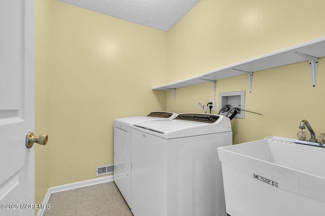 106 Tarpon Dr, Sea Girt, NJ 08750 - washroom with washer and dryer and a textured ceiling