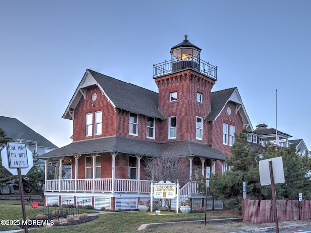 106 Tarpon Dr, Sea Girt, NJ 08750 - view of front of property with a porch, brick siding, and a shingled roof