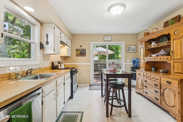 7 Plymouth Dr, Howell, NJ 07731 - kitchen with stainless steel appliances, under cabinet range hood, light flooring, light countertops, and white cabinets