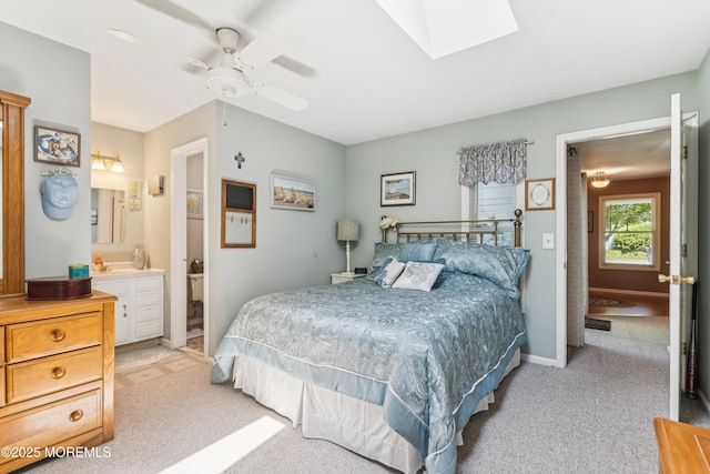 7 Plymouth Dr, Howell, NJ 07731 - bedroom with light colored carpet, a skylight, connected bathroom, and ceiling fan