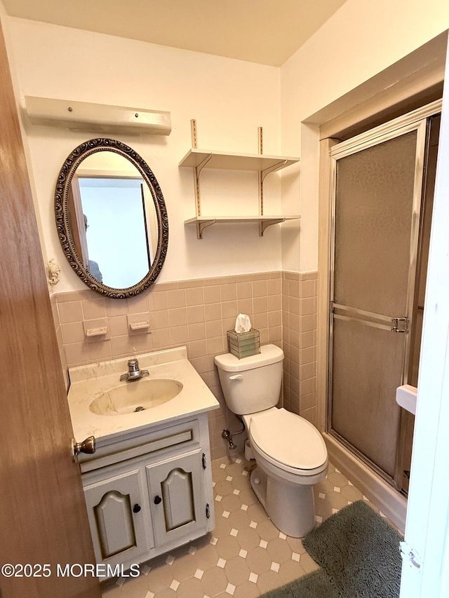 170 E Holly Ln Unit 105, Little Egg Harbor, NJ 08087 - full bathroom with wainscoting, vanity, a shower stall, and tile walls