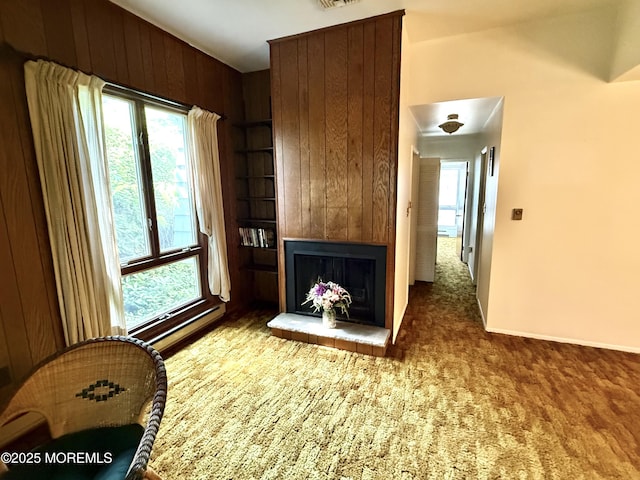 170 E Holly Ln Unit 105, Little Egg Harbor, NJ 08087 - carpeted living area featuring healthy amount of natural light, a fireplace, wood walls, and built in shelves