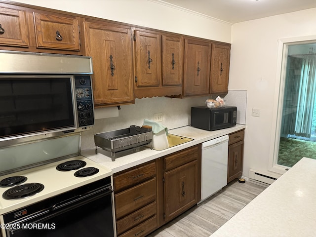 170 E Holly Ln Unit 105, Little Egg Harbor, NJ 08087 - kitchen featuring white dishwasher, electric stove, stainless steel microwave, black microwave, and light countertops