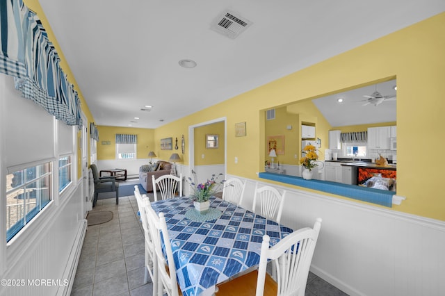19 Elizabeth Ave, Lavallette, NJ 08735 - dining space featuring tile patterned flooring, a ceiling fan, a baseboard heating unit, a wainscoted wall, and recessed lighting