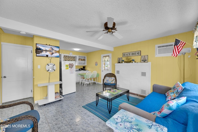 19 Elizabeth Ave, Lavallette, NJ 08735 - living area with a ceiling fan, tile patterned floors, a textured ceiling, and a wall mounted air conditioner