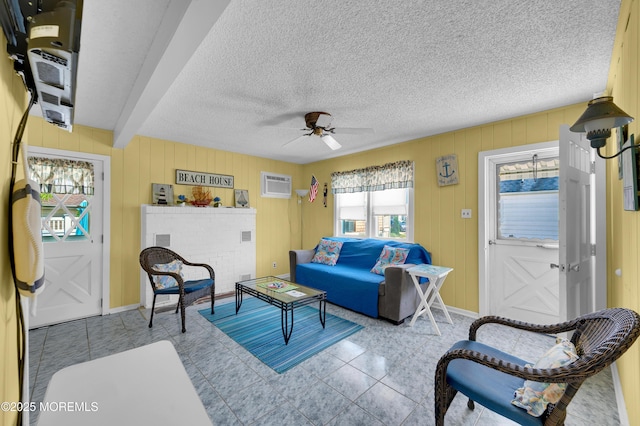 19 Elizabeth Ave, Lavallette, NJ 08735 - tiled living room featuring a wall unit AC, a ceiling fan, and a textured ceiling