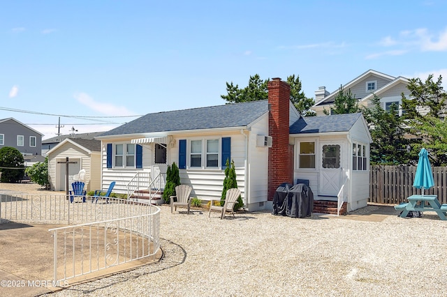 19 Elizabeth Ave, Lavallette, NJ 08735 - bungalow-style house with entry steps, roof with shingles, an outbuilding, crawl space, and a chimney
