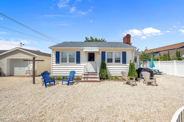 19 Elizabeth Ave, Lavallette, NJ 08735 - back of house with entry steps, a chimney, and a garage