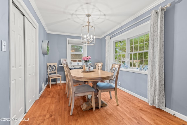 15 Park Blvd, Ocean Twp, NJ 07712 - dining area with crown molding, healthy amount of natural light, a chandelier, and light wood-style flooring