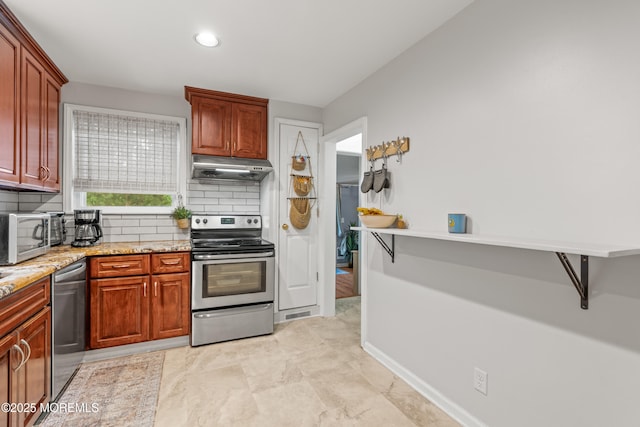 15 Park Blvd, Ocean Twp, NJ 07712 - kitchen with appliances with stainless steel finishes, under cabinet range hood, backsplash, and light stone counters