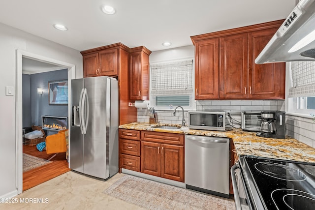 15 Park Blvd, Ocean Twp, NJ 07712 - kitchen featuring appliances with stainless steel finishes, wall chimney exhaust hood, backsplash, light stone countertops, and recessed lighting