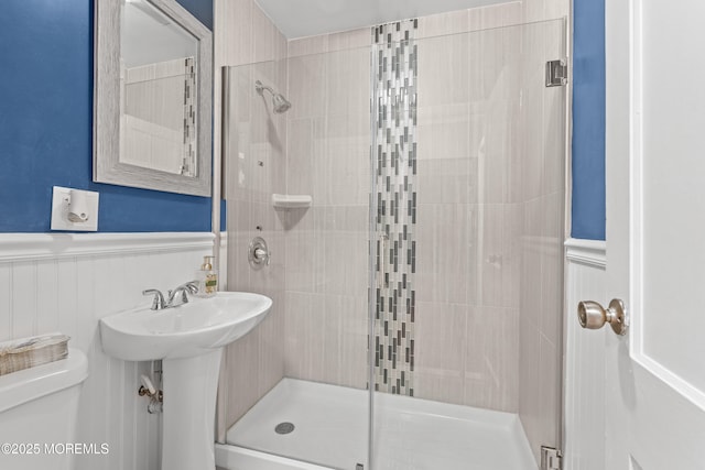 15 Park Blvd, Ocean Twp, NJ 07712 - full bath featuring wainscoting, a shower stall, and a decorative wall