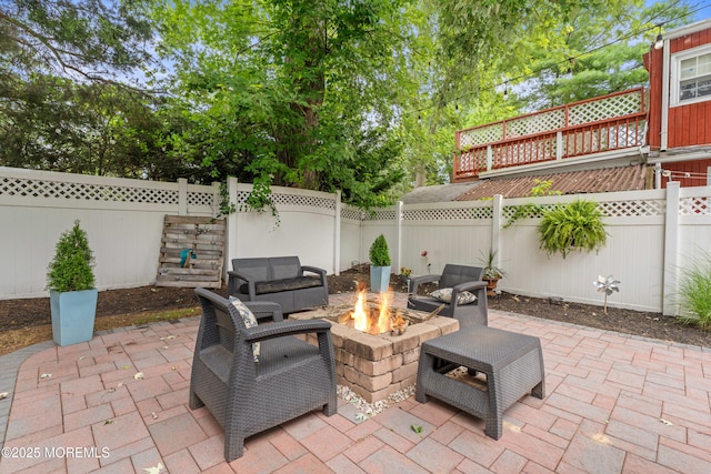 15 Park Blvd, Ocean Twp, NJ 07712 - fenced backyard with an outdoor fire pit and a patio area